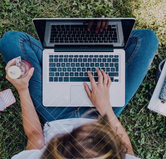 High school girl on laptop with drink