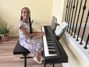 Dhriti enjoys playing the piano