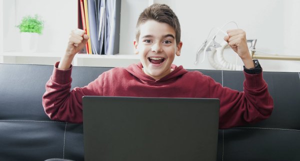 high school student at computer happy successful
