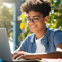 Middle school boy taking online class